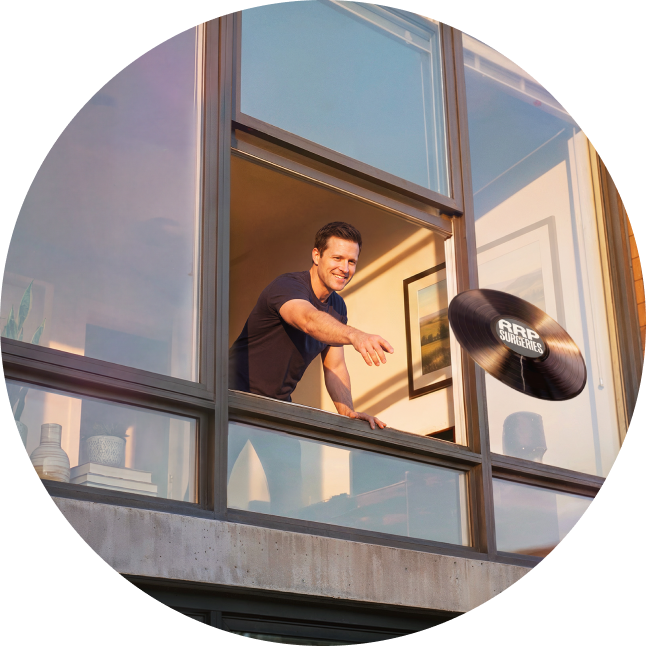 A cropped circle shows a man throwing broken record of RRP surgery out of a window.